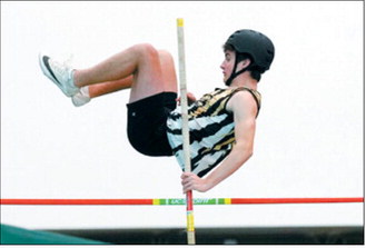 Fletcher Kemp cleared 9 feet, 6 inches to place third in the pole vault April 10 in Grand Forks. Photo by Larry Stokke