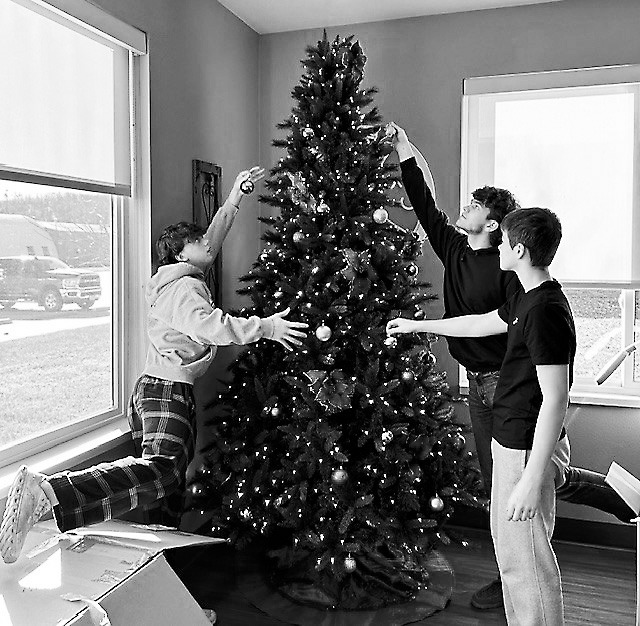 Kaden, Bryce, and Tyson decorating one of the trees at PNC.