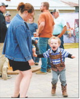 A young festival-goer shows off his Oktoberfest spirit while dancing in traditional German-style attire during Munich’s annual celebration. Photo by Larry Stokke