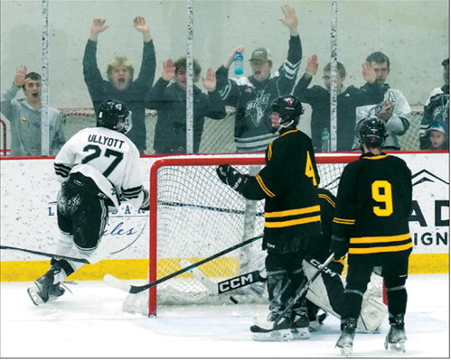 Keaton Ullyott scores a goal against the Grand Forks Stallions with the Blades fans cheering him on. Photo by Larry Stokke