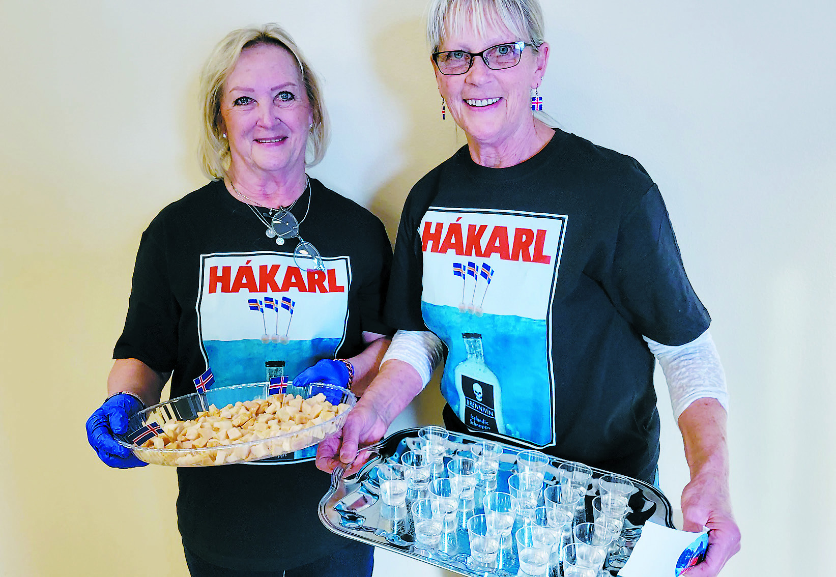 Noreen Carpenter and Jeanette Bjornstad prepare the hákarl and brennivin for the appetizer table.
