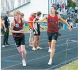 Performers of the meet, brothers Tanner and Caleb McDonald helping the Cardinals to a first place finish in the 4x400 relay. Braxton Lindseth and Gavin Trottier were also members of the relay team. Photo by Larry Stokke