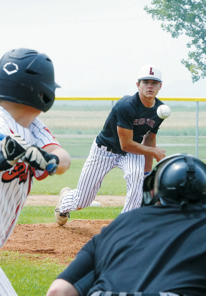 Nick Kingzett throws a strike, caught by catcher Landon Schneider. Photo by Larry Stokke.