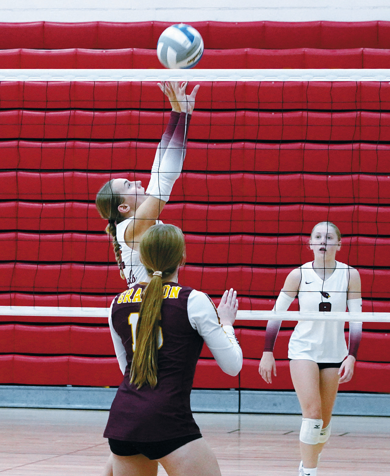 Kemi Morstad sets the ball high to her teammate in the game against the Grafton Spoilers to win the tournament Oct. 12 in Langdon. Photo by Larry Stokke.