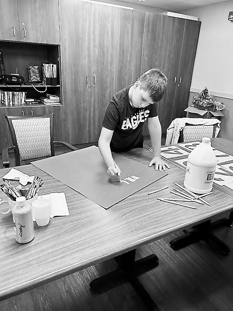 Blake working on his homecoming poster at PNC last week.