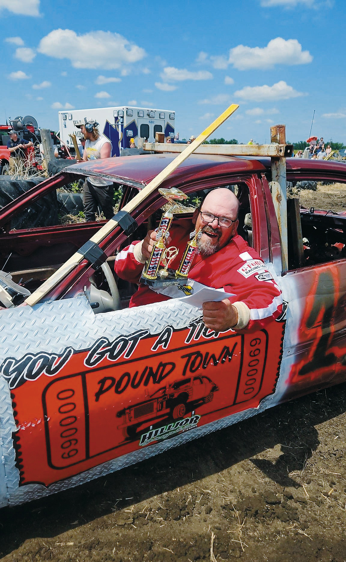 Brian Laporte poses for a photo after winning the compact class in his #11 car. Photo by Jessica Reidhammer.