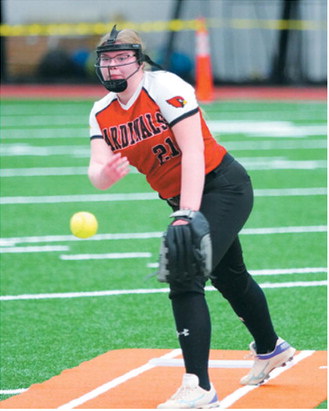 Victoria Matthews eyes the batter and sends a strike over the plate in Belcourt on March 28. Photo by Larry Stokke