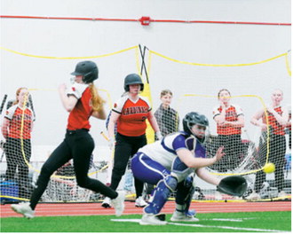 Sophi Witzel crosses the plate to score a run for the Cards. Photo by Larry Stokke