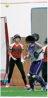 Harper Jacobson crosses home plate and tacks on a run for the Cards. Photo by Larry Stokke