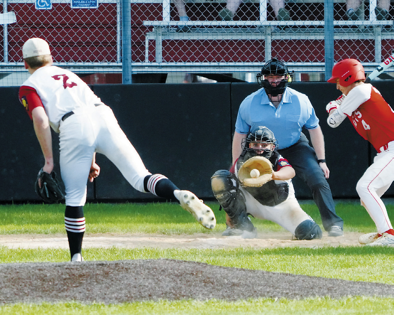 Landon Schneider gloves a strike in the game against MayPort. Photo by Larry Stokke.
