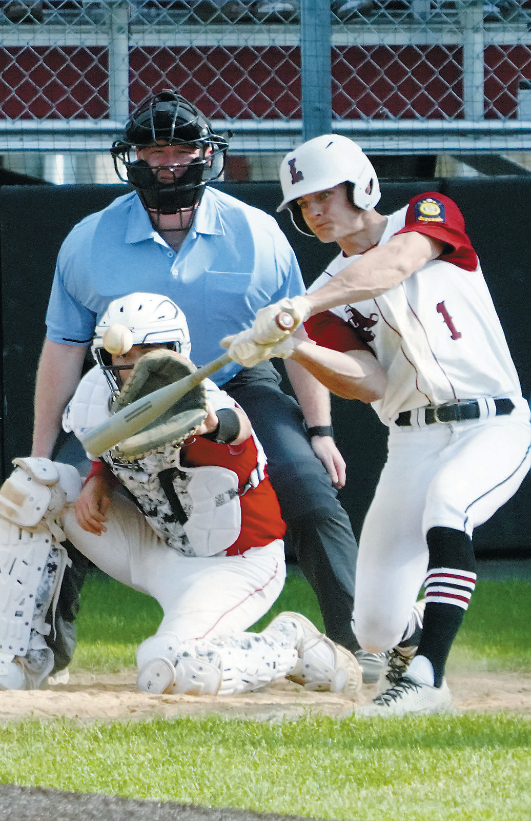 Nic Kingzett gets a base hit in the Red Sox game in Langdon on June 6. Photo by Larry Stokke.