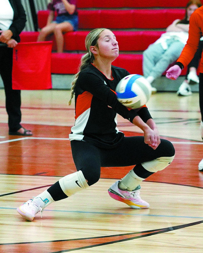 Colbie Furstenau with one of her 13 digs in the Tornadoes game against the Cardinals. Photo by Larry Stokke.