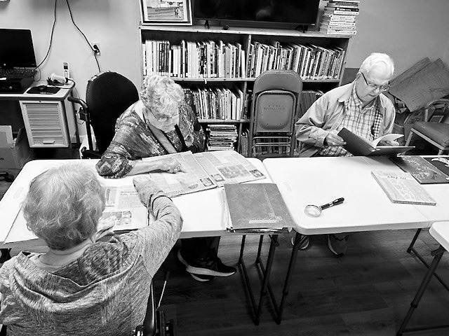 Bonnie, Darlene and Dale at the library.