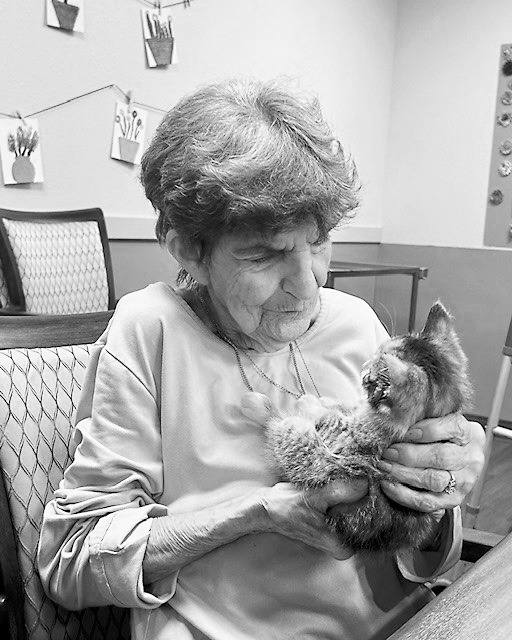 Rose visiting with a little kitten.