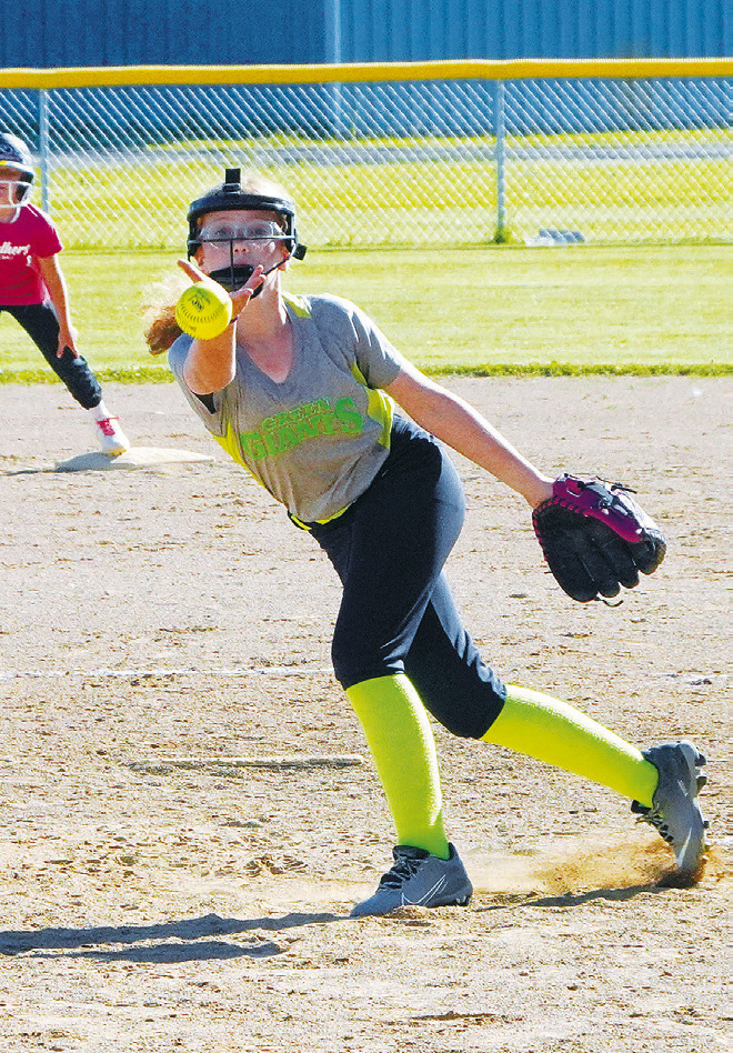 Jenna Wild lays a strike across the plate against the Pink Panthers in Cavalier. Photo by Larry Stokke.