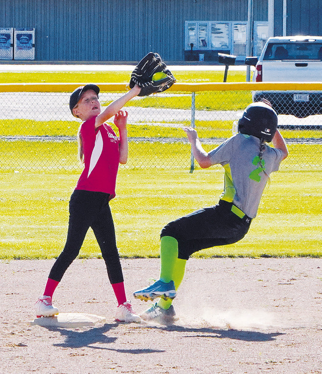 Breck Krivarchka has a great catch at 2nd base putting out a Green Giants base runner. Photo by Larry Stokke.