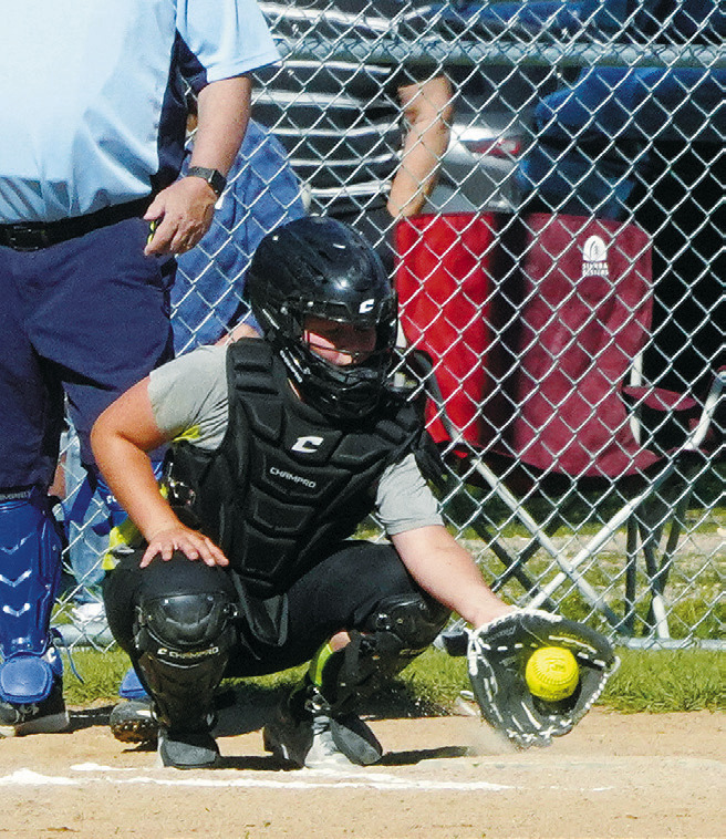 Lizzy Hakanson gloves the ball in the game against the Pink Panthers. Photo by Larry Stokke.