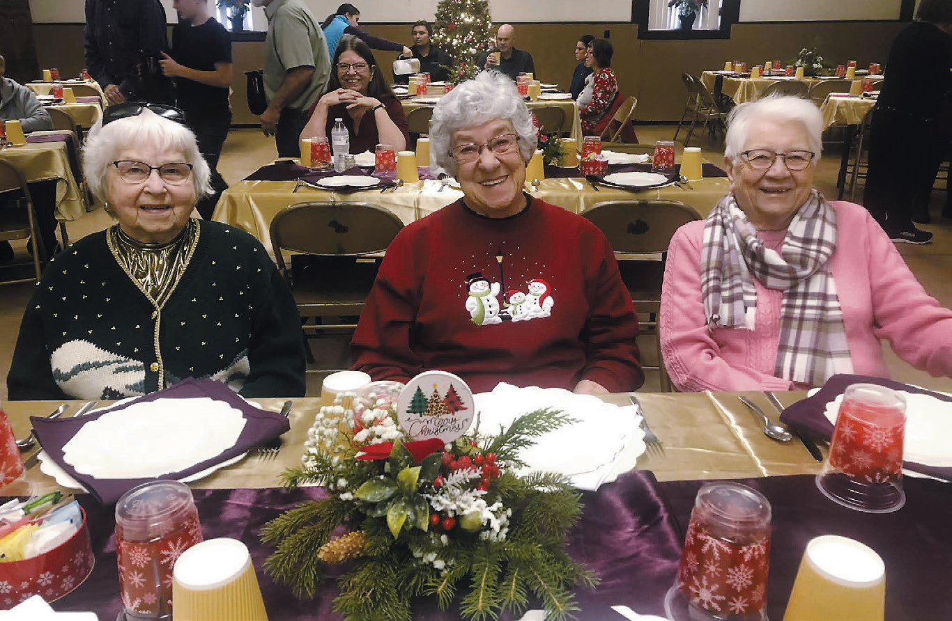 Attendees enjoy the meal at the Community Christmas Meal. Photo by Melanie Thornberg.