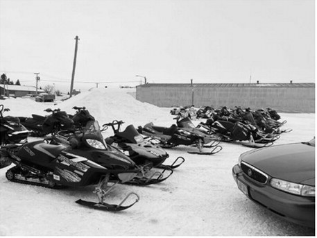 Snowmobiles are lined up outside At the Hop in Langdon during the 2025 Fun Run. Submitted photo