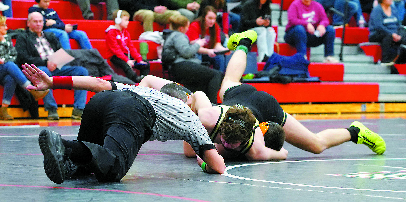 Bryce Carignan in the 172 lb. weight class won by a pinfall. Photo by Larry Stokke.