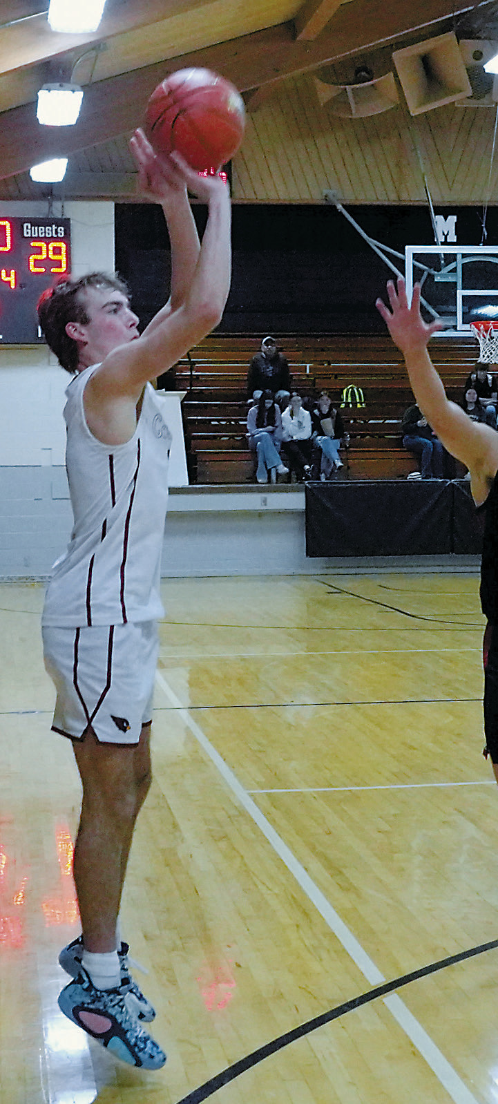 Jayden Lee drains a three point shot in the win over the Warriors. Photo by Larry Stokke.