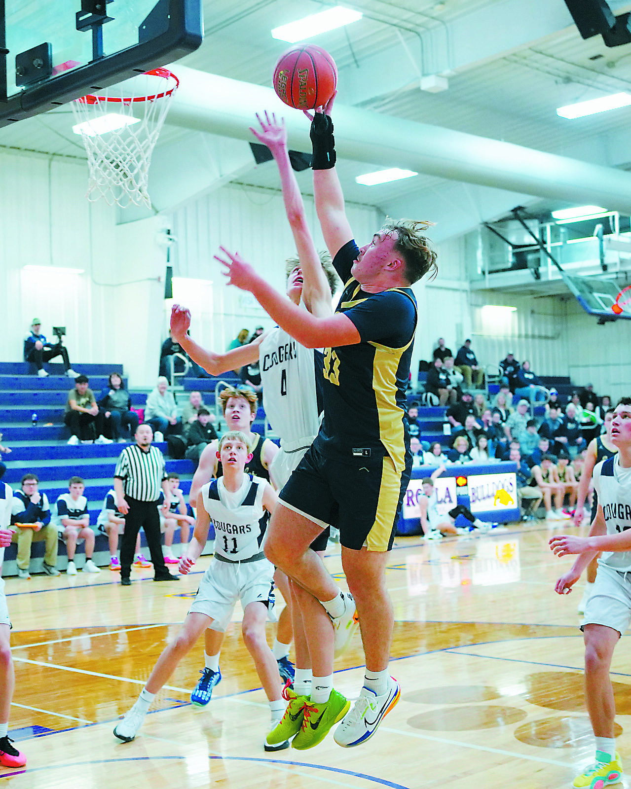 Kade Schafer drains a layup in the lane during the Eagles' win over the Cougars in Rolla on Jan. 7. Photo by Larry Stokke.
