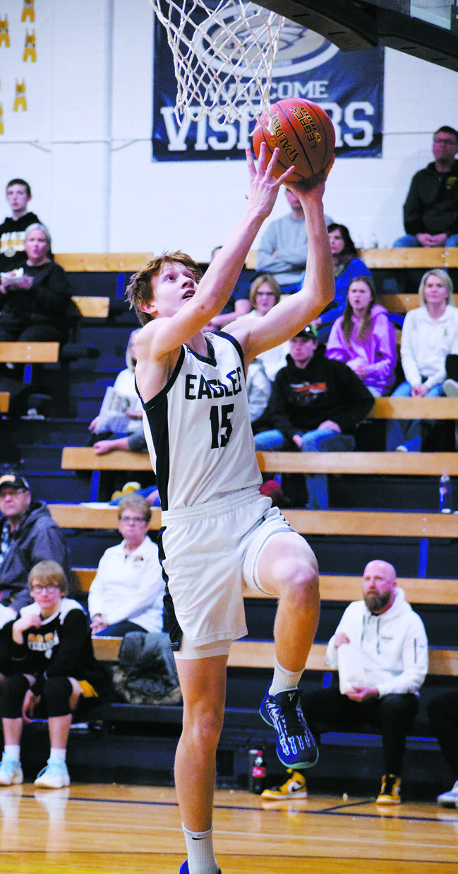 Garret Willits goes up for a basket in the game against Park River-Fordvile-Lankin. Photo by Ashley Schafer.