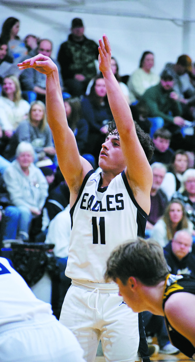 Grant Cosley sinks a basket in the win over Park River-Fordville-Lankin. Photo by Ashley Schafer.