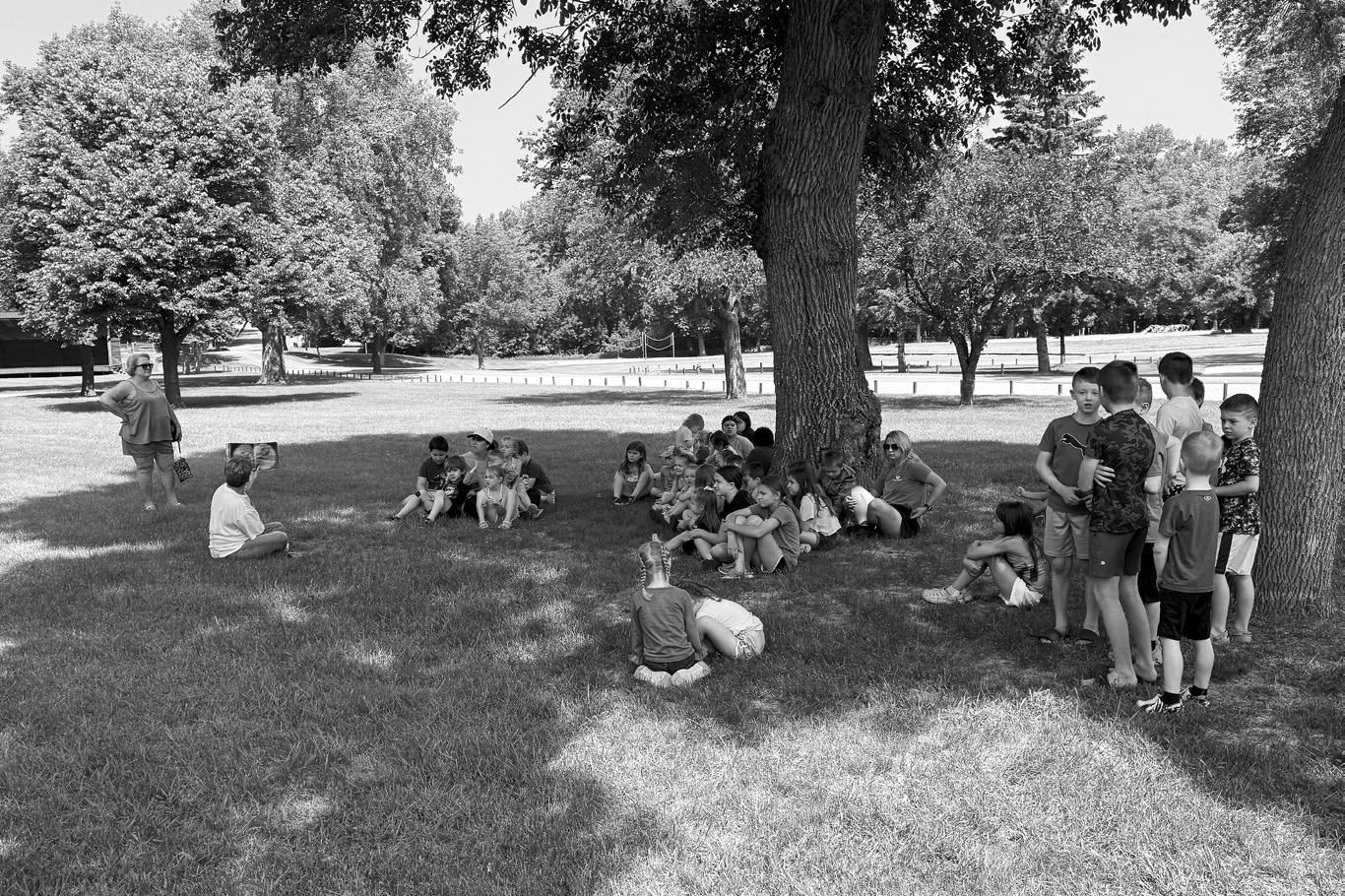 Michelle Sehrt read 'Llama Llama goes Camping’ and ‘Let's go on a Hike’ for reading in the park.