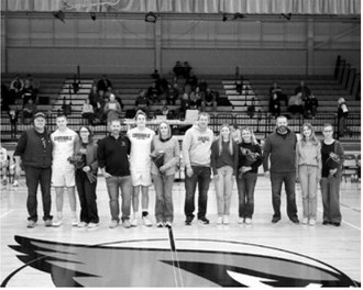 Seniors and parents at the last home game were introduced at the beginning of the game. L-R Steve Swanson, Levi Swanson, Brenna Swanson; Steve McDonald, Tanner McDonald, Kristy McDonald; Robbie Lorenz, Nora Lorenz, Wendy Lorenz; and Jesse Johnson, Mya Johnson, and Christa Johnson. Photo by Larry Stokke