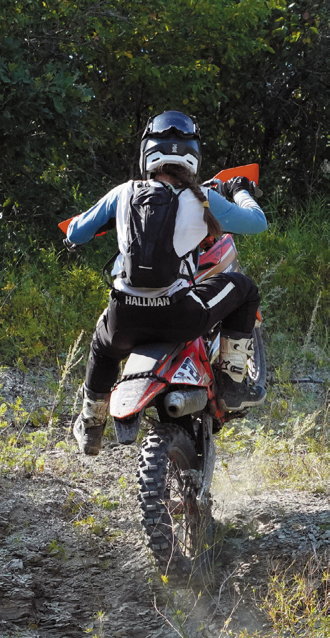 Lexi Bata crests a shale hill at the Peterson Hare Scramble. Photo by Larry Stokke.
