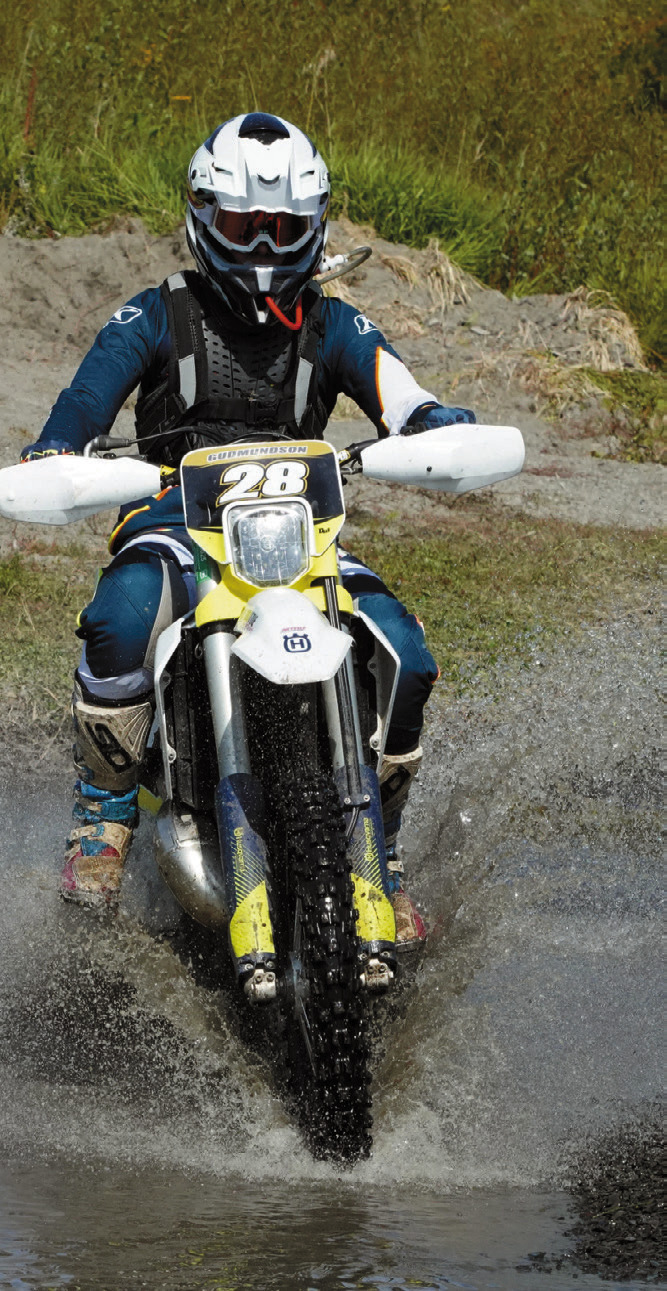 Jana Gudmundson crosses through the water at the Peterson Hare Scramble. Photo by Larry Stokke.