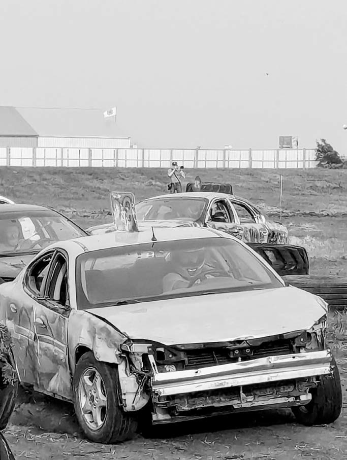 Larry in the Wild: Like a rare creature in his natural habitat, Borderland Press photographer Larry Stokke was spotted at the Bush and Redneck Truck Races during the Pembina County Fair, caught mid-click by Kristina Halverson. See Larry? Snap a pic and send it our way. Your photo could be the next ‘Larry in the Wild’ sighting we publish!
