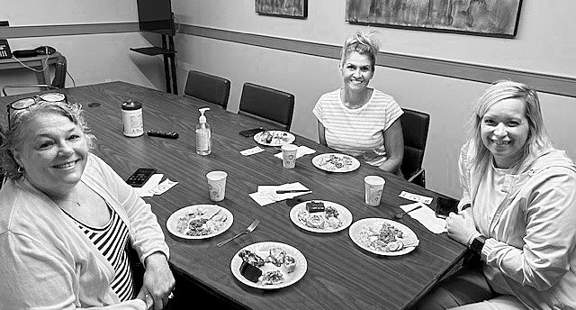 Judges (L-R) Pastor Shilice Larsen, LaRae Horgan, and Lacey Mathison tasting side dishes and desserts while contemplating which are the best.