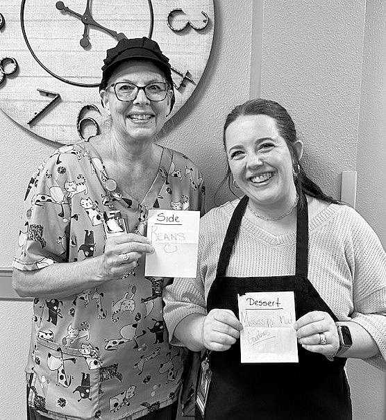 Nancy Belanus (left) won the side dish competition with her baked beans, and Kelsey Buechler (right) won the best dessert category with her Mississippi mud ice cream cake.