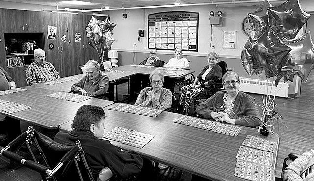 Residents pose for a photo during bingo extravaganza.