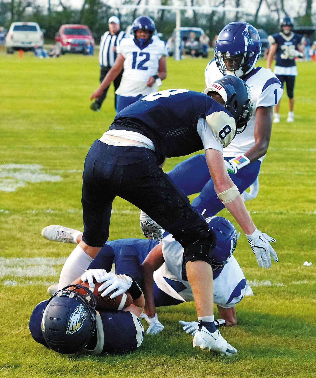 Zeke Symington with a great catch under pressure and a slide across the goal line to tack on 6 points. Photo by Larry Stokke.
