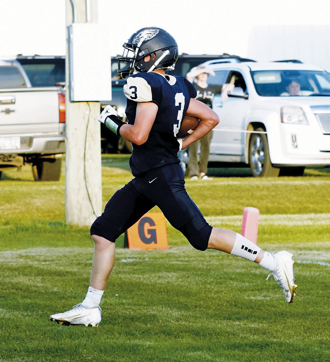 Oakley Brown crosses the goal line to score for the Eagles against the Four Winds Indians. Photo by Larry Stokke.