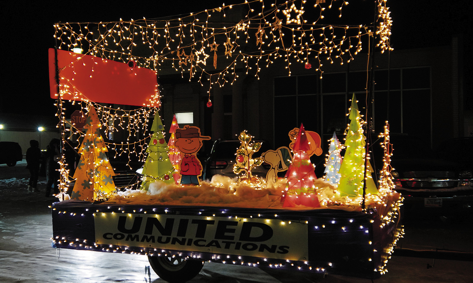 United Communications' Snoopy themed Christmas float in the parade. Photo by Larry Stokke.