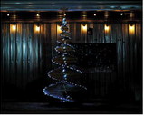 The beautifully lit wooden Christmas tree on Boyd Block stage. Photo by Larry Stokke.