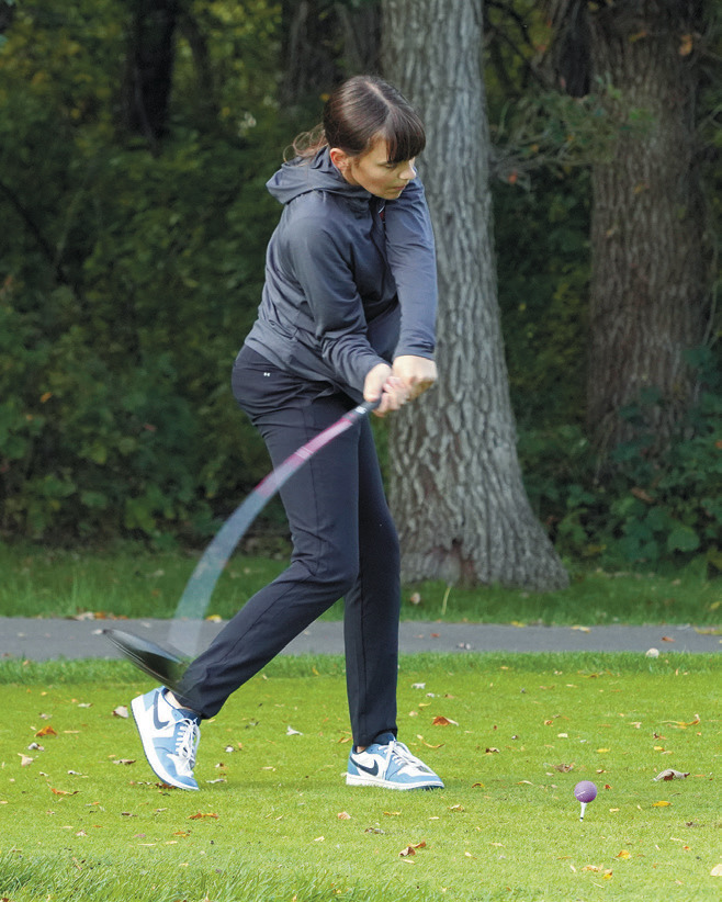 Kadence Wirth puts some bend in her club as she tees off at the Region 4 Golf Tournament Photo by Larry Stokke.
