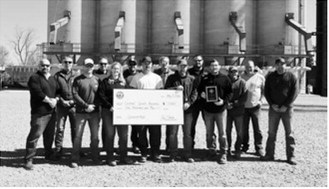 Pictured, from left, are Northern Plains Railroad representatives Ben Liden, Ryan Riskey, Derek Muir, Ben Chalich, Jessica Tennison and Jody Wilson; and North Prairie Ag Nekoma team members Chris Lee, Robbie Lorenz, Clint Arens, Paul Medbery, Josh Schaefer, Jeff Orminston, Chris Schaefer and Josh Overby, representing the Cardinal Sports Boosters.