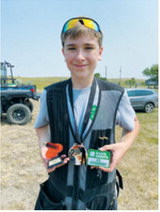 Carl H. displays his awards from the 4-H State Shotgun Tournament. He placed first in junior division trap, finished second overall and recorded a perfect round of 25 straight. Submitted photo