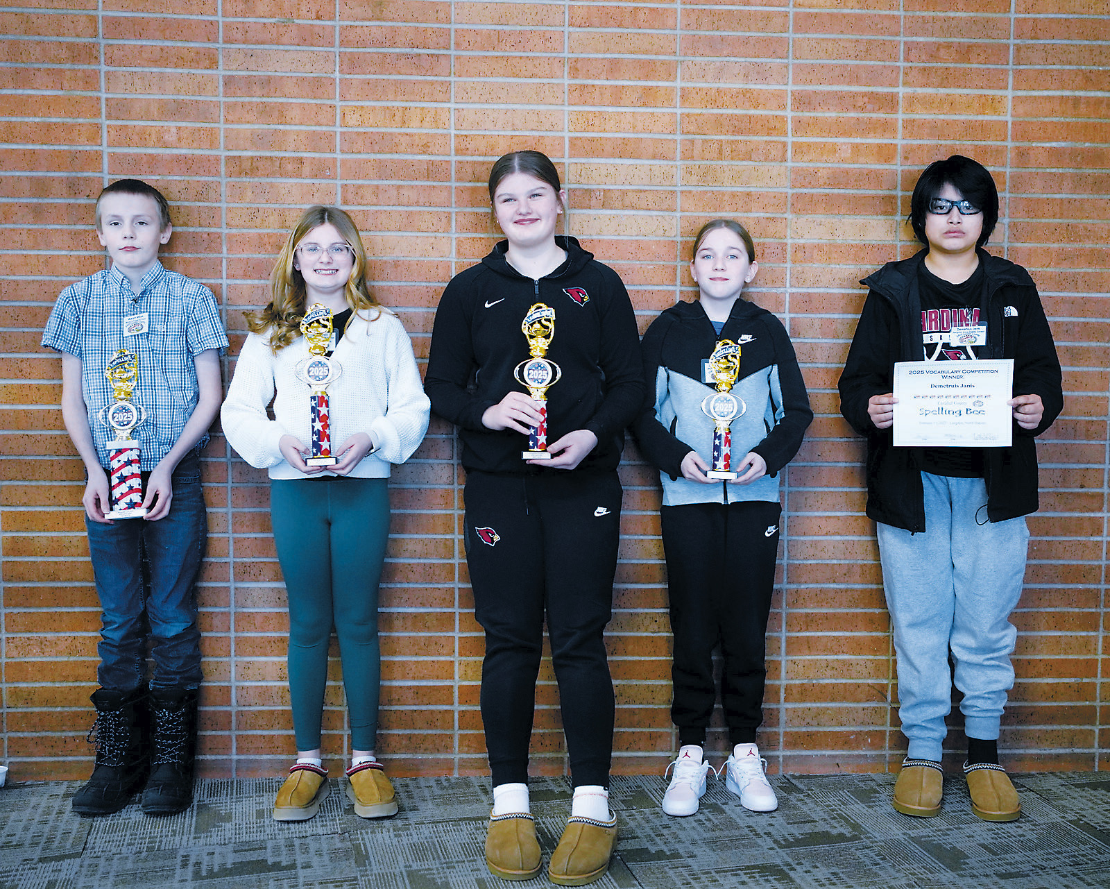 Last week, the Cavalier County Spelling Bee and Vocabulary Contest was held. Here are the winners from left to right: 1st place Aaron Miles of Munich School, 2nd place Paisley Feil of Langdon School, 3rd place Fenja Lawson of Langdon School, 4th place Sophia Longie of Munich School, and the winner of the written spelling competition, Demetrius Janis of Langdon School. Photo by Larry Stokke.