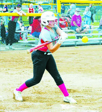 Colby Forest eyes the ball and delivers a base hit. Photo by Larry Stokke