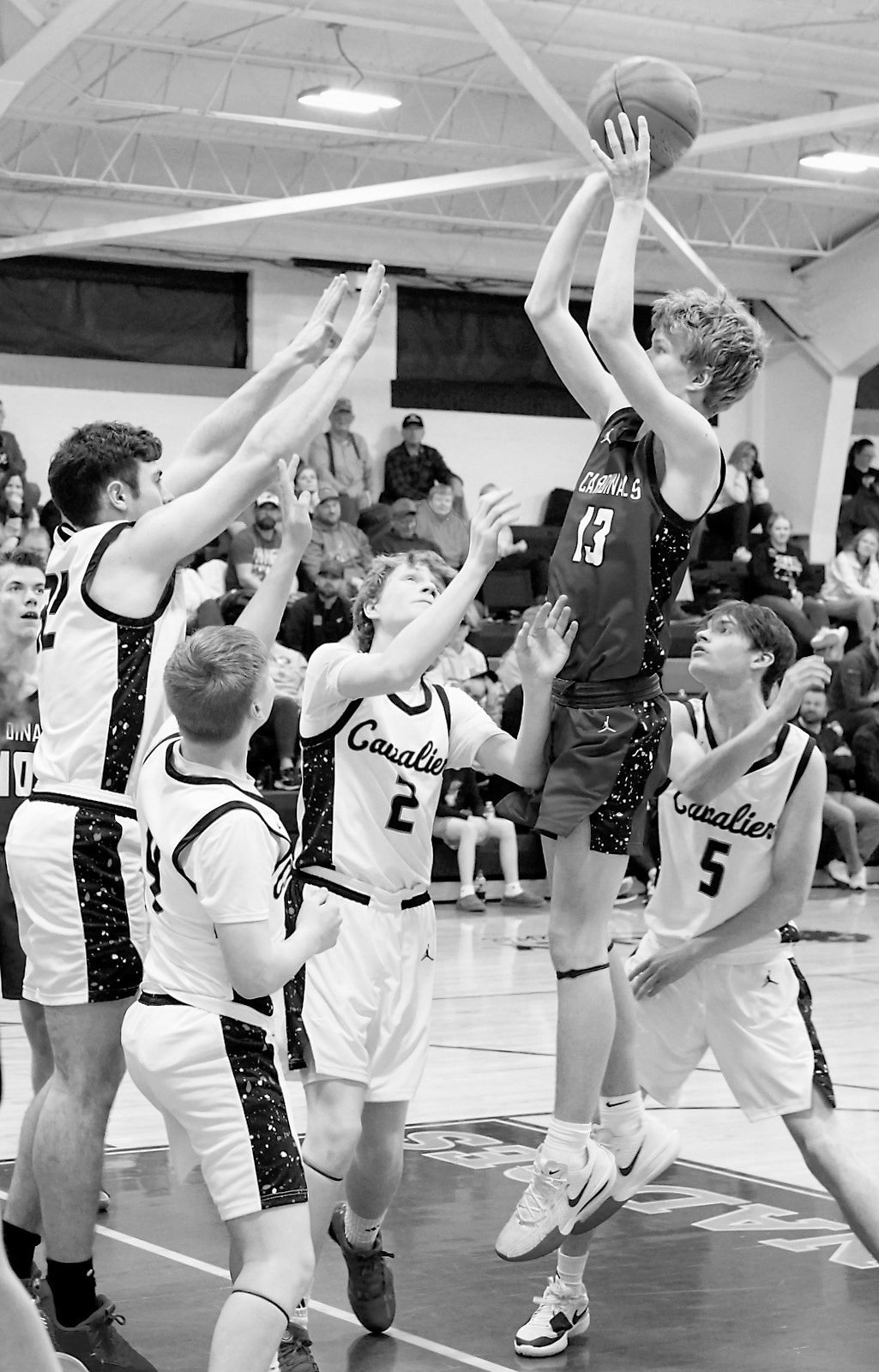 Caleb McDonald pulls off a shot while surrounded by four Tornadoes. Photo by Larry Stokke.