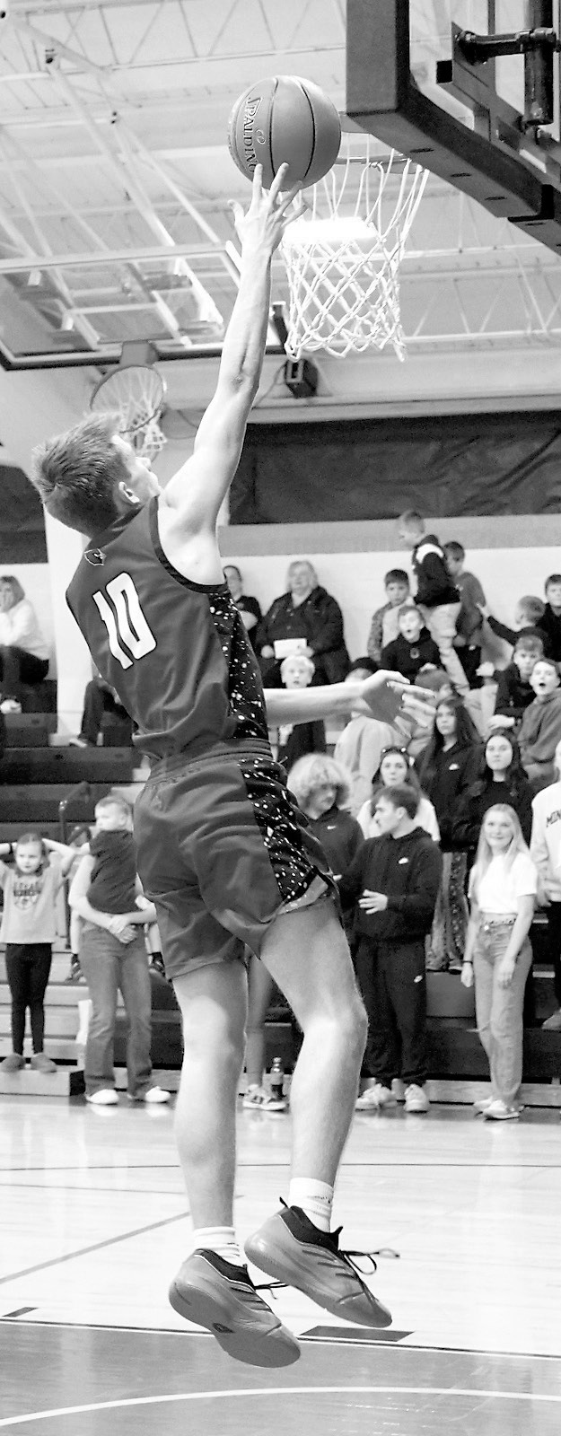 Maddux Stremick chipped in 11 points to the Cards' 66-point game against the Tornadoes. Photo by Larry Stokke.