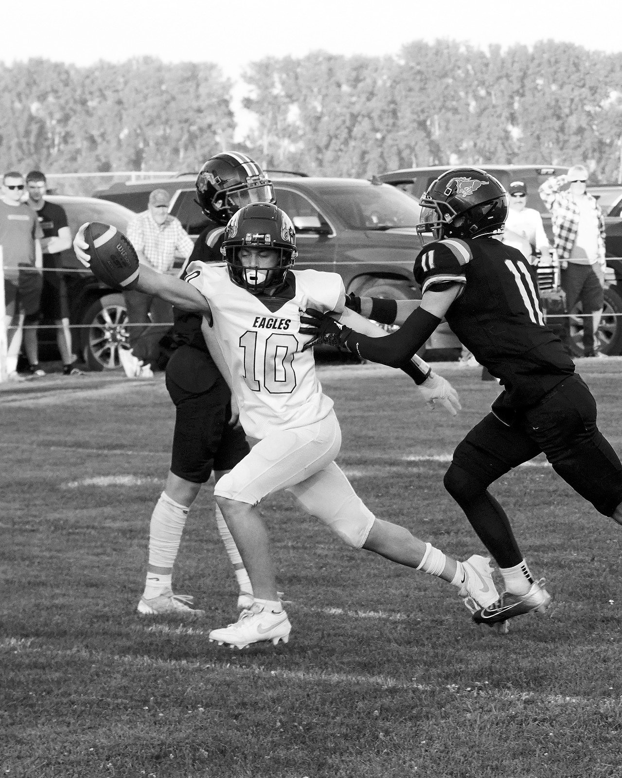 Kaden Moore reaches out to cross the goal line, scoring for the Eagles in the win over the Mustangs. Photo by Larry Stokke.