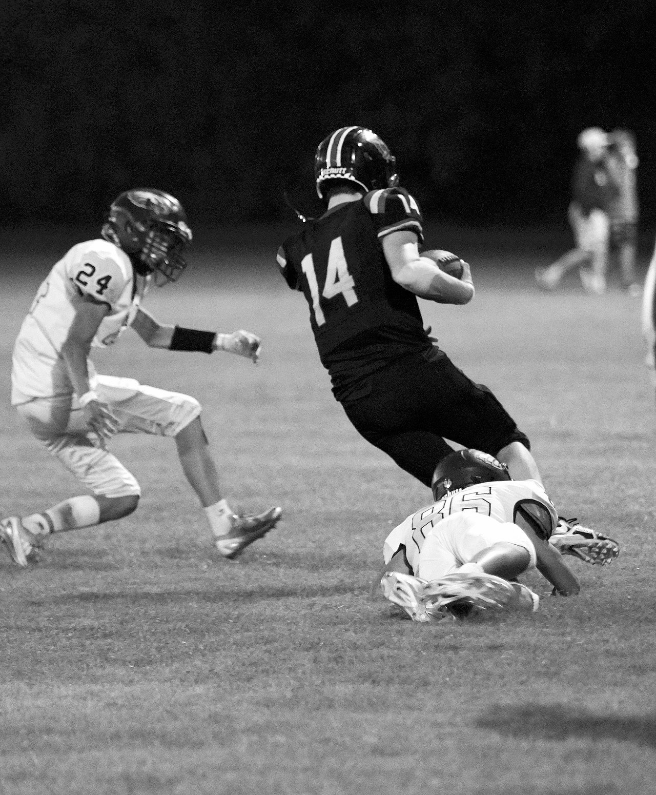 Christopher Longtin brings down Gunner Lietz, keeping him from scoring. Photo by Larry Stokke.