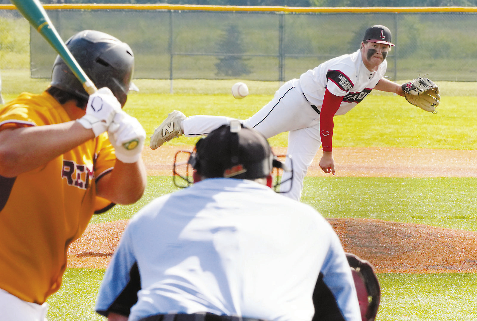 Devin Hakanson winds up and strikes out a Park River player. Photo by Larry Stokke.